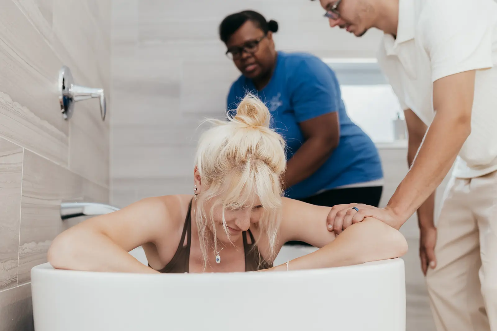 A doula giving hands-on support during labor